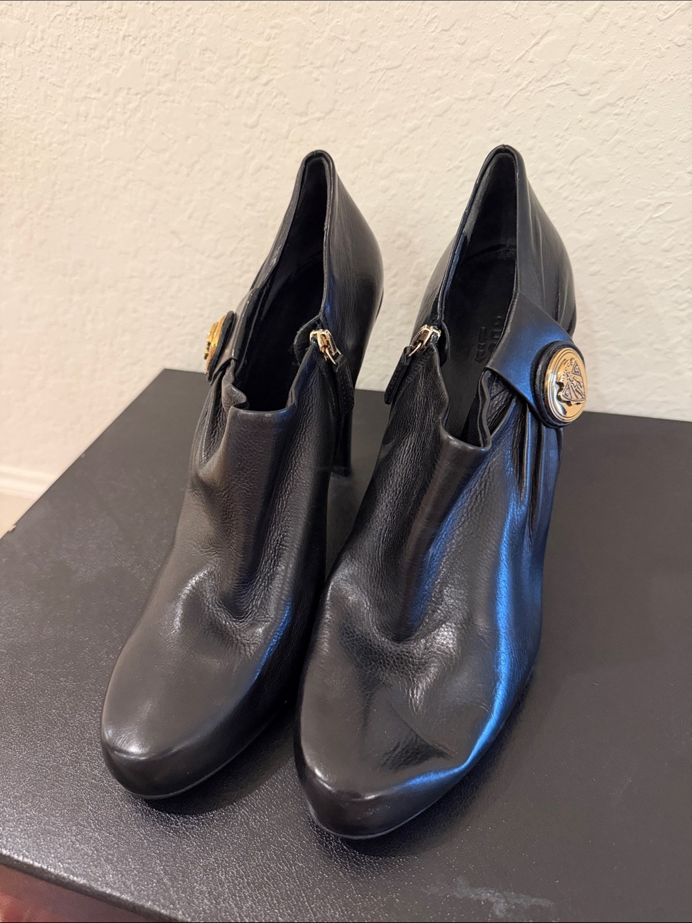 Gucci  NEVER WORN Black Leather High-Heel Ankle Booties - Gold Medallion Accent - Picture 2 of 7